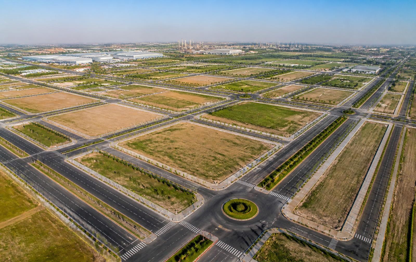Aerial view of planned smart city plot grid with wide roads in Dholera